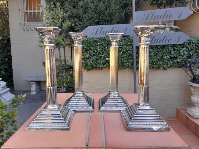 A Set of Four 20th Century Elizabeth II Silver-Plated Corinthian Column Candlesticks