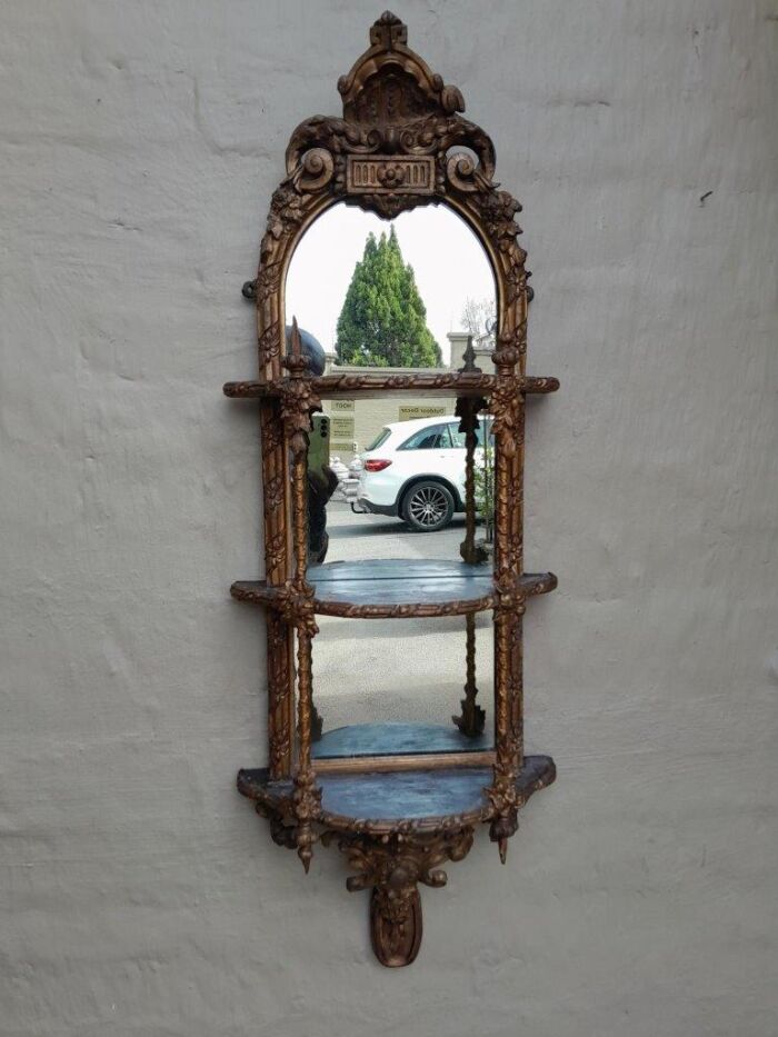 A 19th Century Ornately Carved and Gilded Three tier Mirror