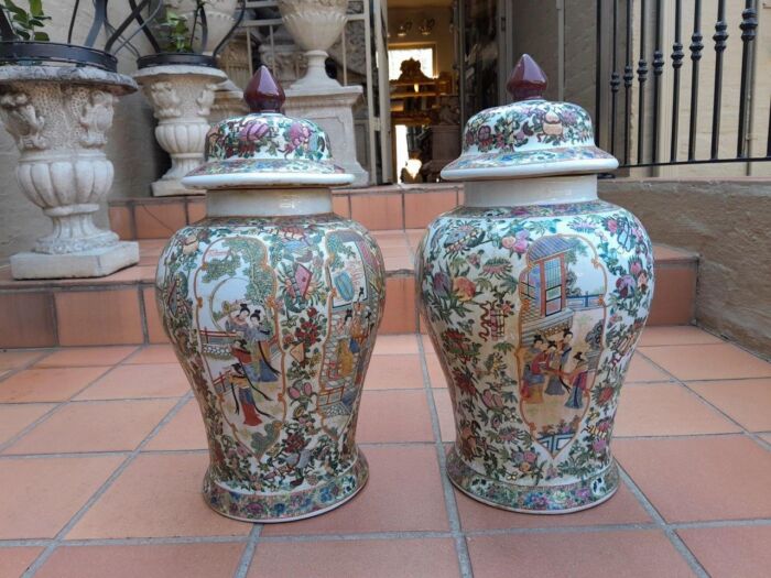 A 20th Century Pair of Chinese Famille Rose Porcelain Covered Urns