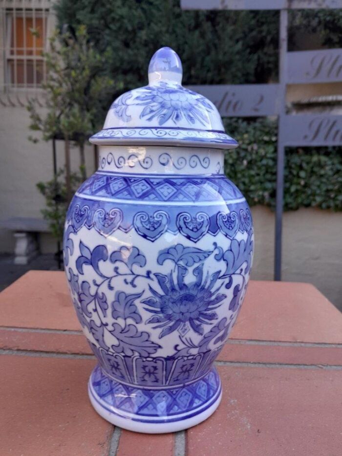 A 20th Century Chinese Blue And White Painted Vase With Lid