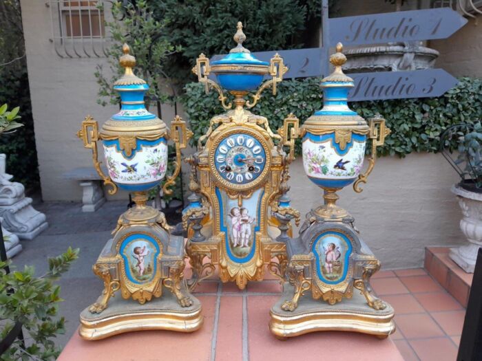 A 19th Century French  Gilt Metal And Porcelain Clock Garniture Set On Original Giltwood Bases And Original Key - Image 2