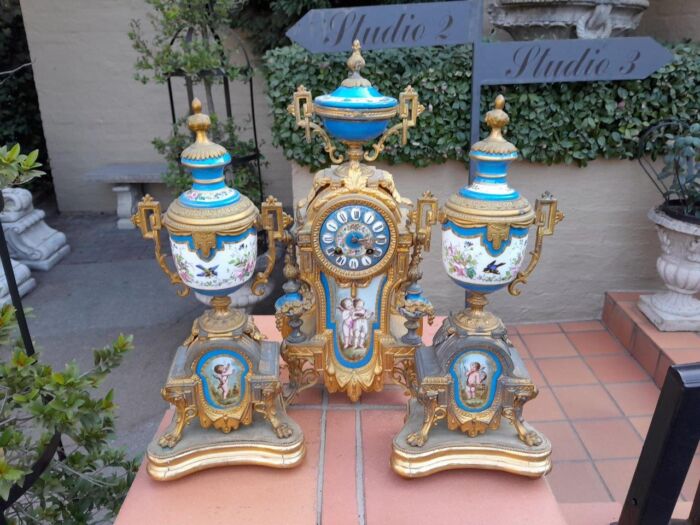 A 19th Century French  Gilt Metal And Porcelain Clock Garniture Set On Original Giltwood Bases And Original Key - Image 3