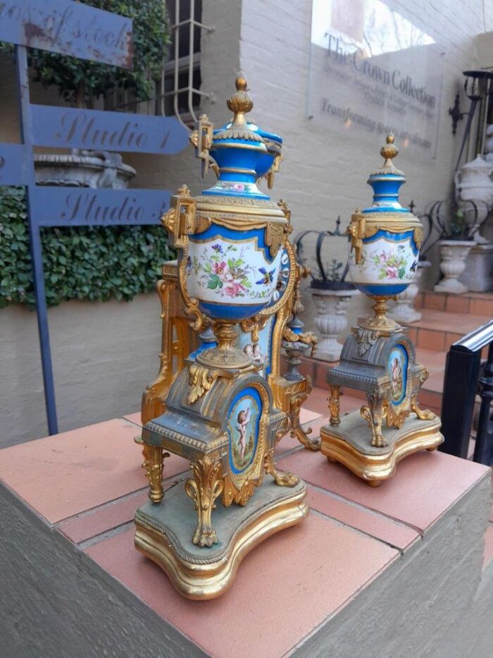 A 19th Century French  Gilt Metal And Porcelain Clock Garniture Set On Original Giltwood Bases And Original Key - Image 5