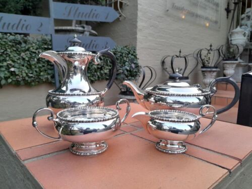 A 20th Century Silver-Plated Walker And Hall 4 Piece Tea Set With Wooden Handles