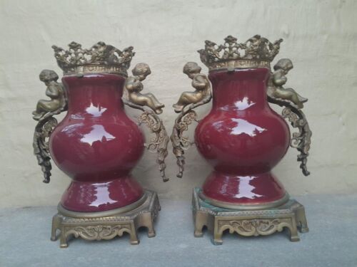 A Pair Of French Decorative Porcelain Cherub & Ormolu Urns