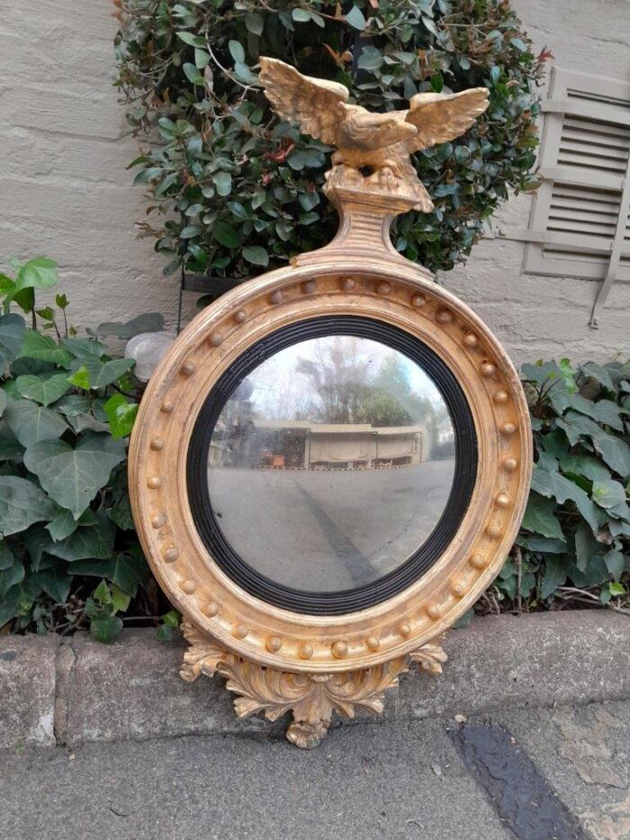 An  English Antique 19th Century Circa 1830s Regency Convex Mirror with Eagle and Ball Detail