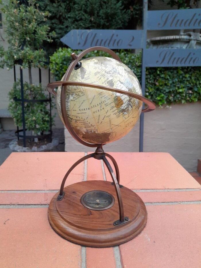 A 20th Century Library Rotating Globe with Brass Mounts and on Wooden Base with Compass