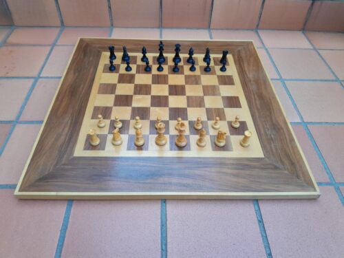 A Wooden Chess Set Comprising Chess Pieces And A Chess Board