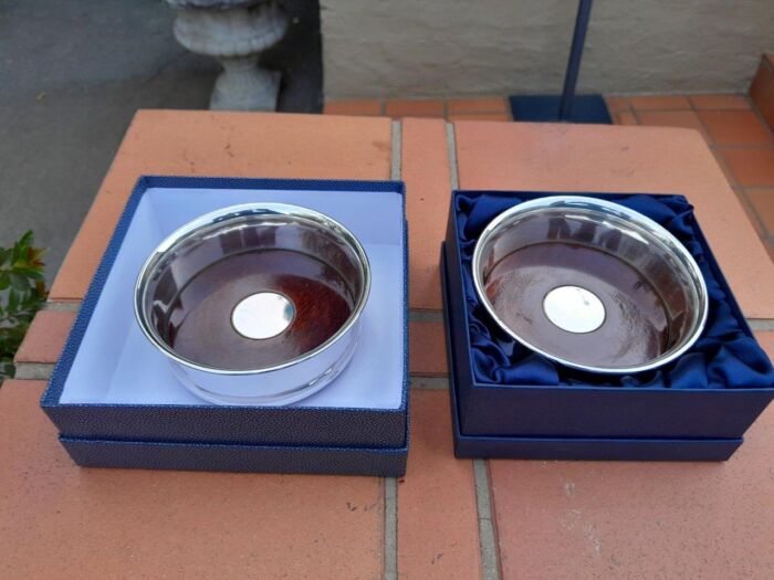 A Pair of Elizabeth II Silver Mounted Wine Coasters In Original Presentation Boxes  Weight 313grams