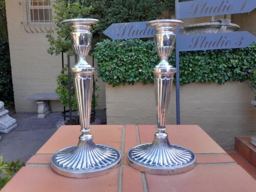 An Early 19th Century Pair of George III Old Sheffield Plated Candlesticks On Loaded Bases