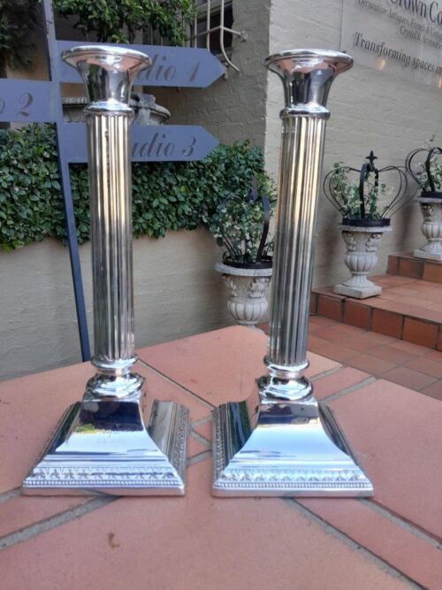 A Pair Of Silver-Plated Column Candlesticks ND