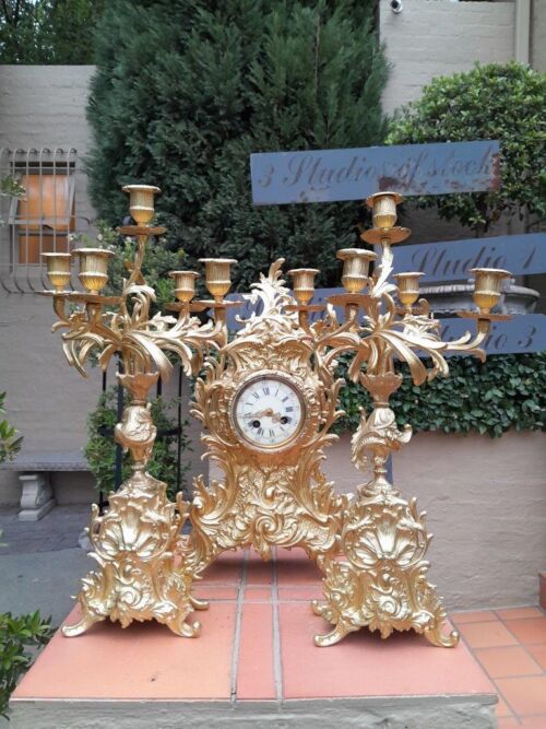 An Antique 19th Century French Rococo Style Gilt Metal Clock and Candelabra Garniture Set