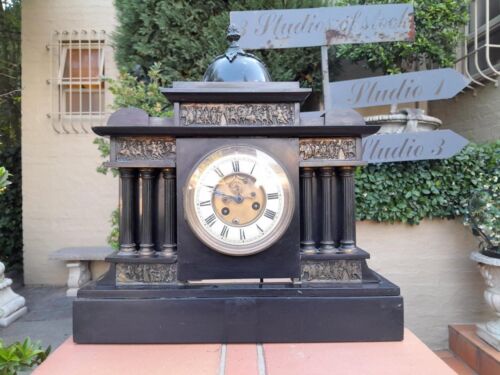 An Antique French Black Slate And Marble Clock