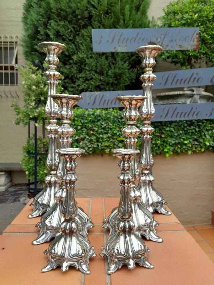 A  20th Century Ornate Set of Six Candlesticks / Holders / Sticks as in Three Graduated Pairs of Candlesticks / Holders