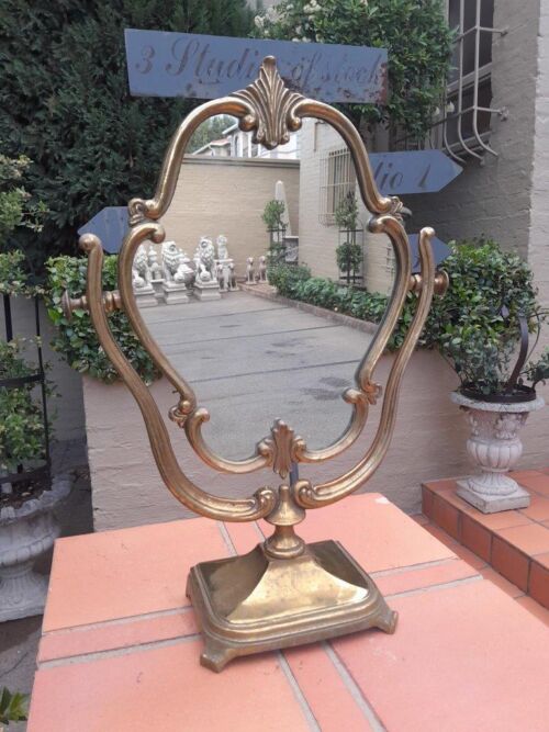 A Gilt Metal Table Mirror on Base