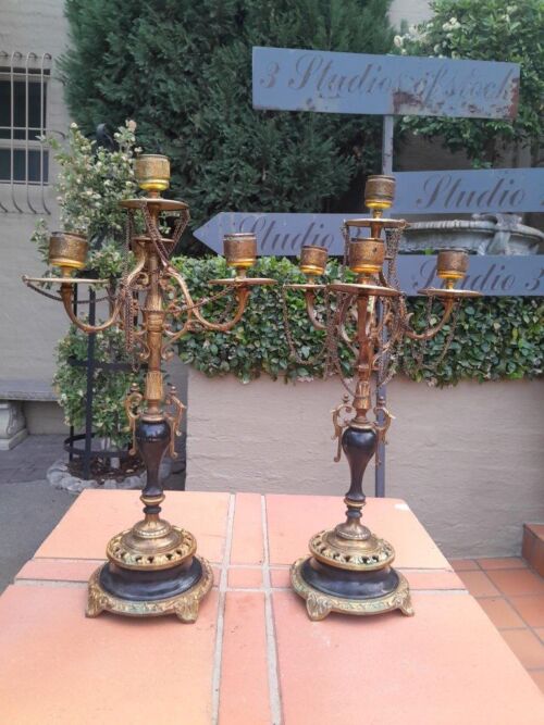 A Pair of Brass and Composite Candelabra