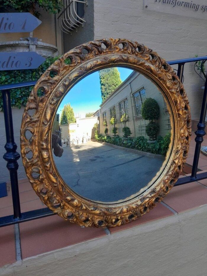 A 20th Century Carved Wooden Gilt Round Convex Mirror