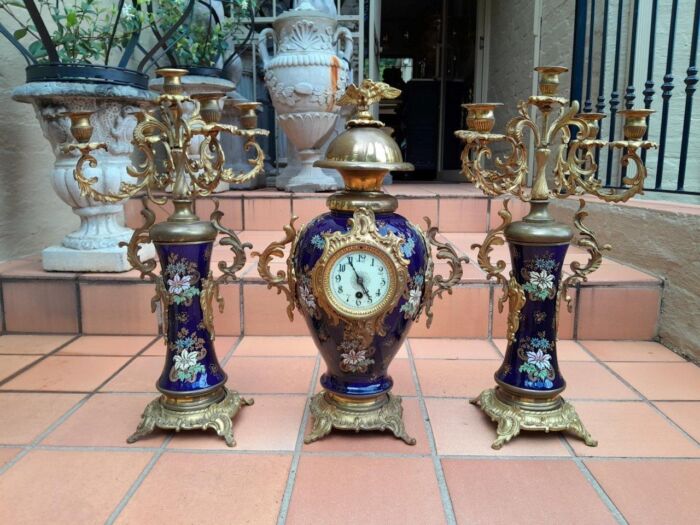 An Early 20th Century (Circa 1911) French Rococo Style Clock Garniture Set With Gilt Metal Mounts. Clock has key and pendulum. 