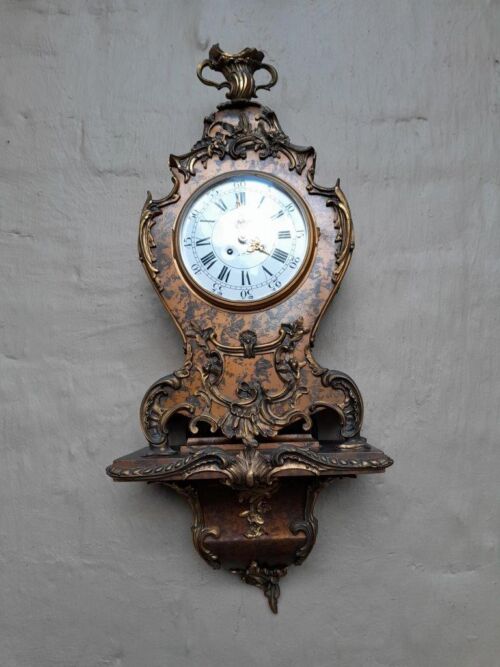 A French Louis XV Style Roccoco Clock with Matching Sconce and Key. Signed Hour Lavigne / Paris Has been serviced