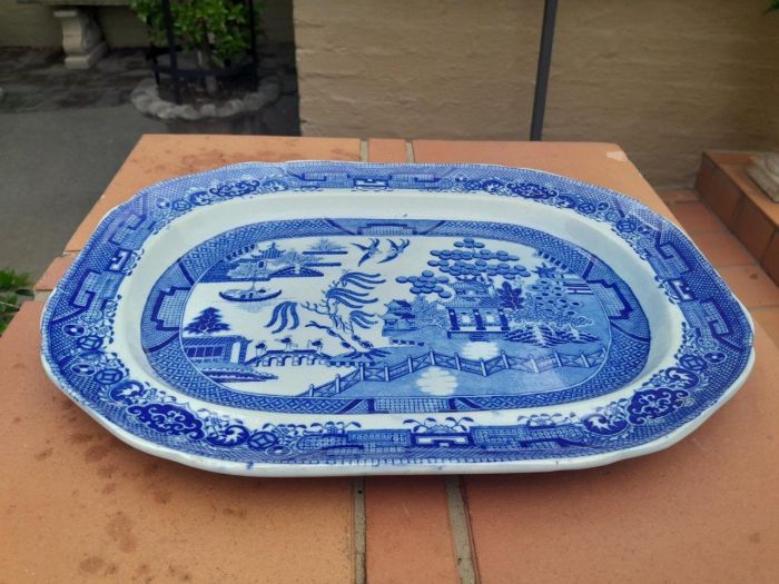 An Antique Blue and White Willow Pattern Porcelain Platter