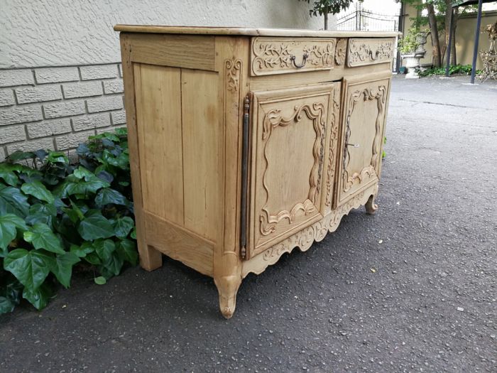 A Provincial Style French Oak Server in a Contemporary Bleached / Natural Wood Finish with Cream Marble Top - Image 4