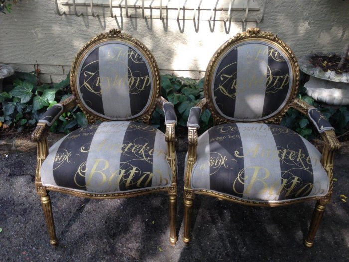 A Pair of French Style Arm Chairs Hand Gilded With Gold Leaf And Upholstered In an Imported Script Fabric - Image 2