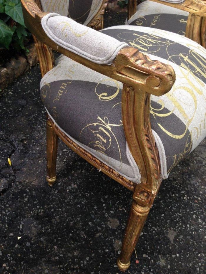 A Pair of French Style Arm Chairs Hand Gilded With Gold Leaf And Upholstered In an Imported Script Fabric - Image 6