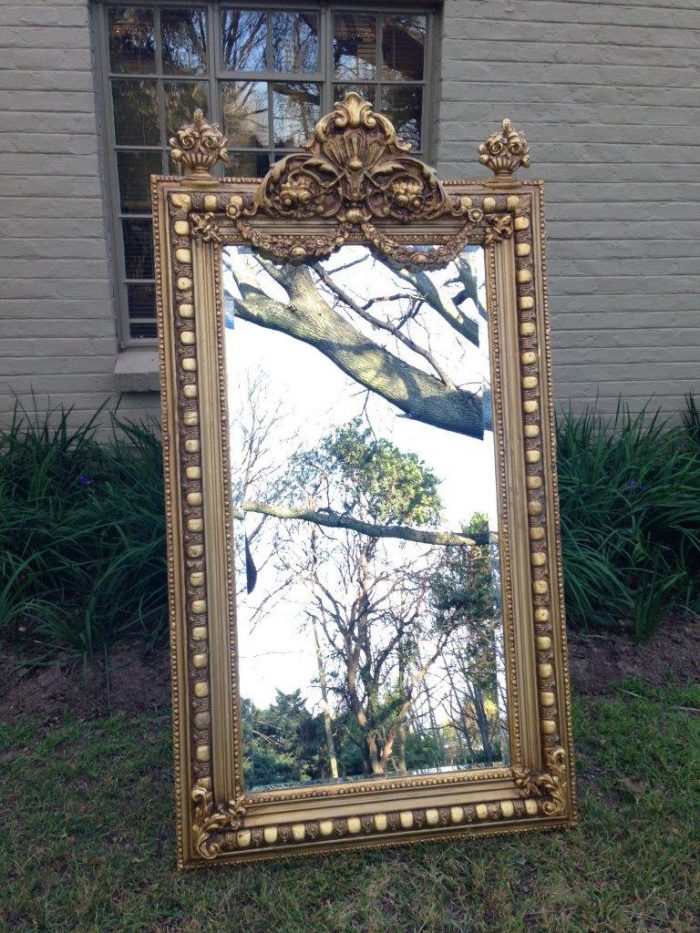 An Ornate Carved Painted Mirror