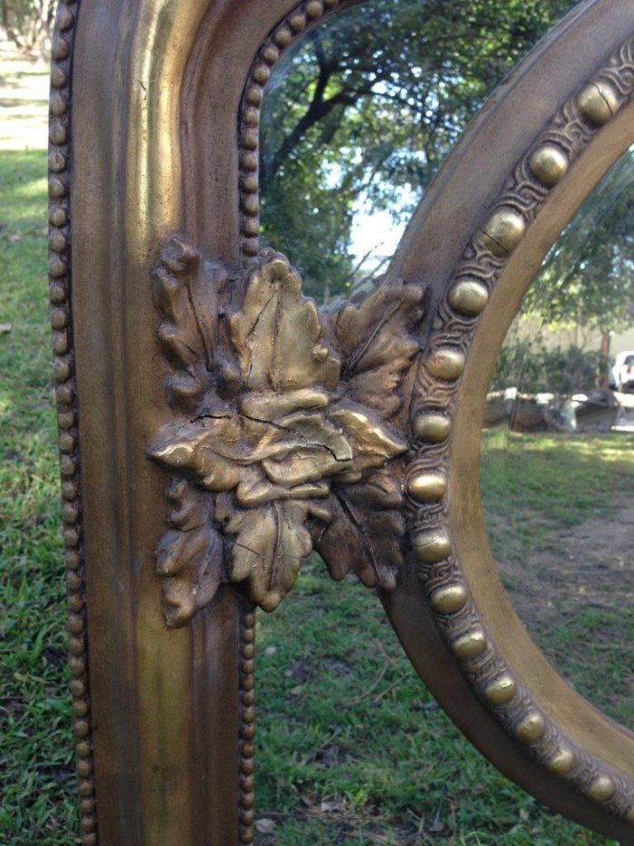 A French Ornate carved mirror with a bevelled oval centre section - Image 4