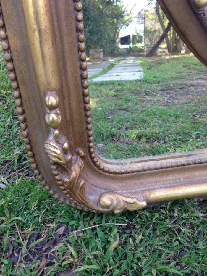 A French Ornate carved mirror with a bevelled oval centre section - Image 7