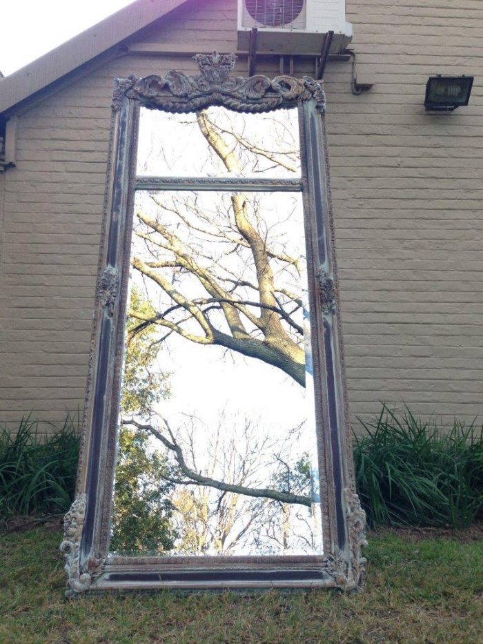 An Ornate Carved & Bevelled Painted Mirror