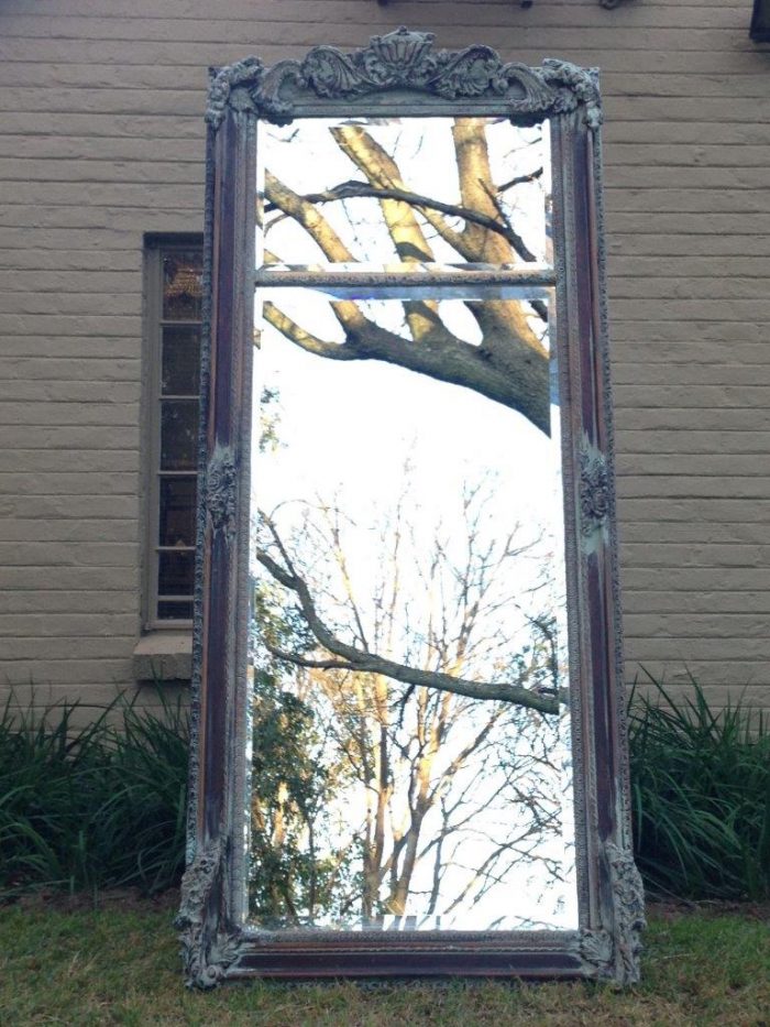 An Ornate Carved & Bevelled Painted Mirror