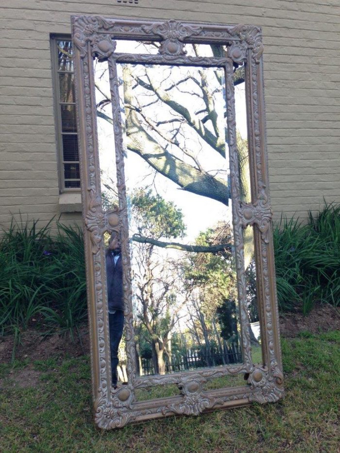 An Ornate Carved & Painted Mirror