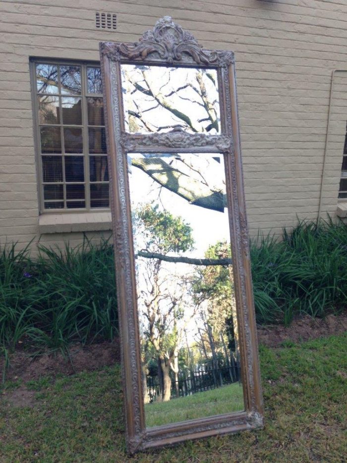 An Ornate Carved & Bevelled Painted Mirror