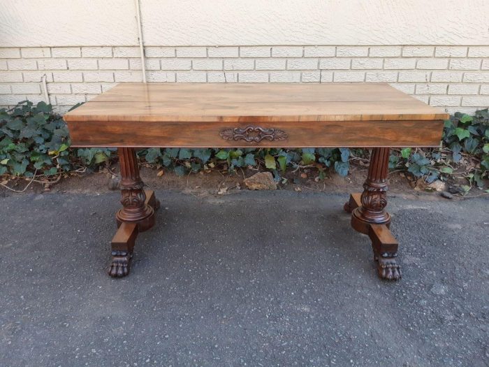 A William IV Rosewood Library Table With Brass Castors