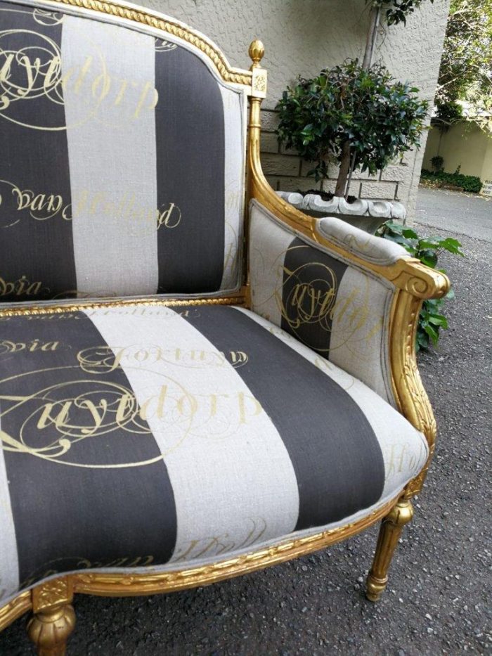 A French Antique Hand-Carved And Gilded Settee, Upholstered In A Hand Painted Imported Linen Fabric With Gold Script - Image 7