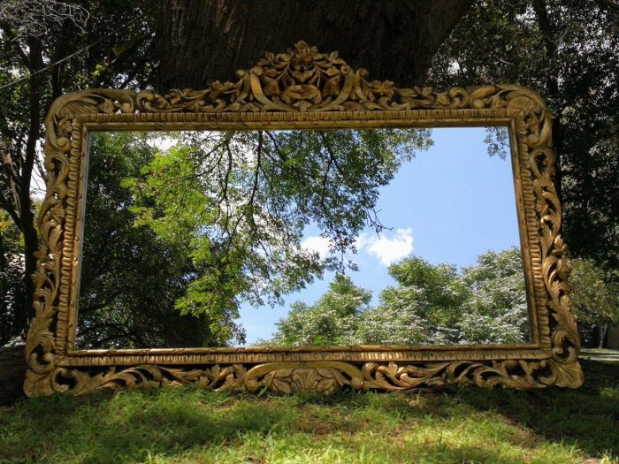 Ornately Carved Oval Gilded Mirror