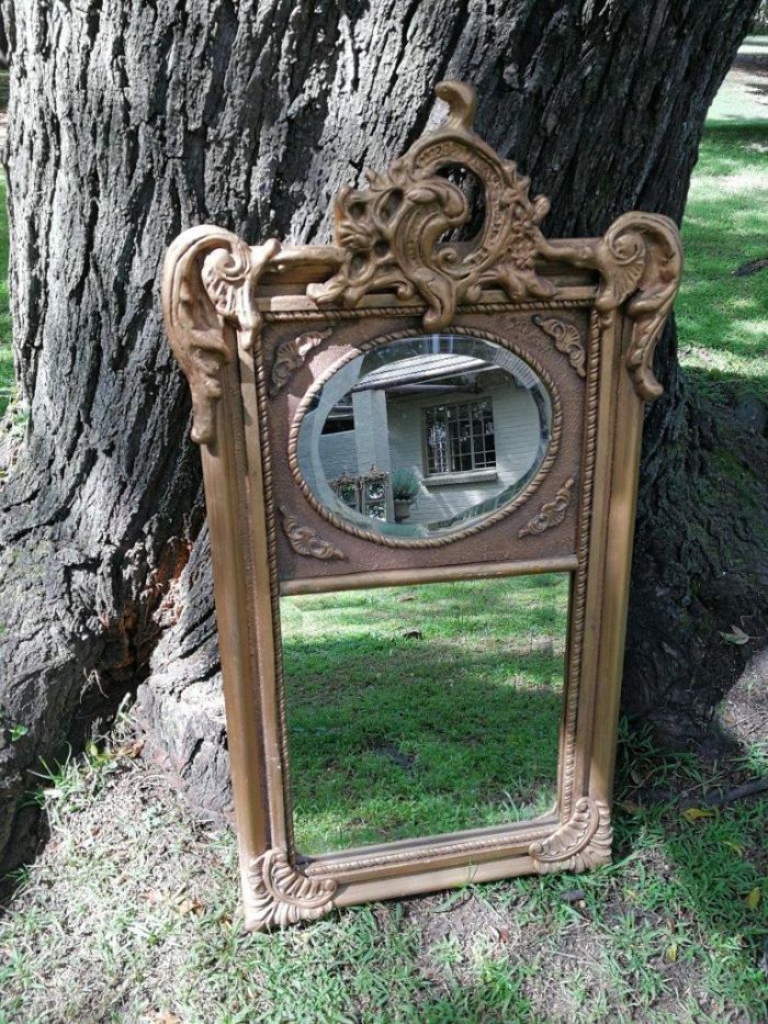 Ornately Carved Oval Gilded Mirror