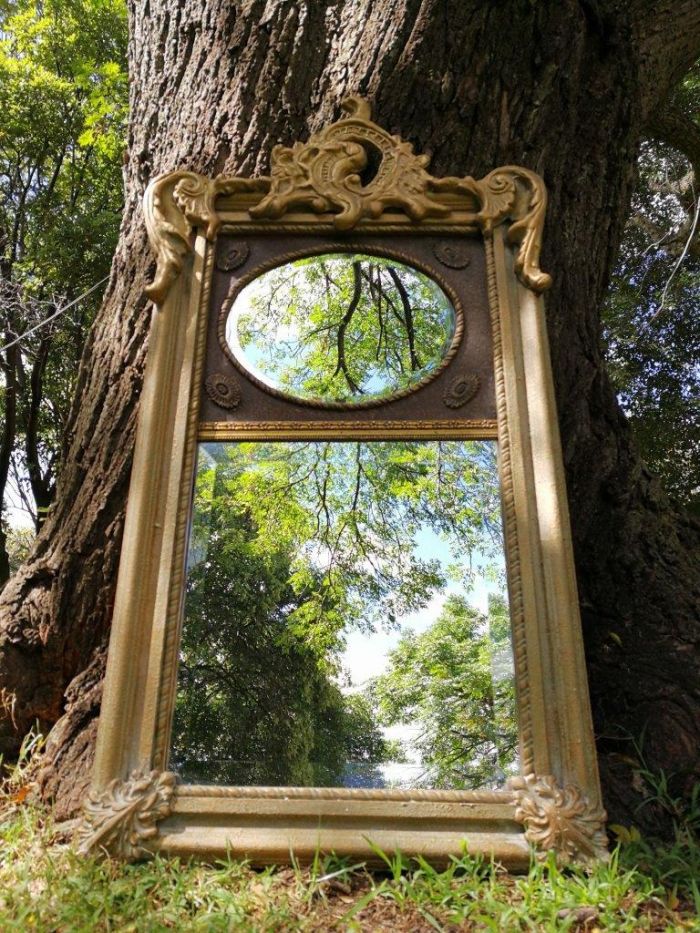 Ornately Carved Oval Gilded Mirror