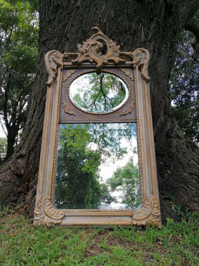 Ornately Carved Oval Gilded Mirror