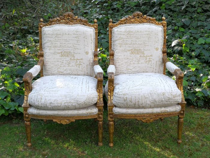 Pair of 19th Century style gilded and carved armchairs