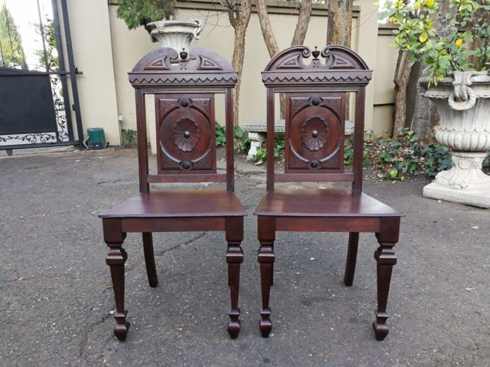 A Pair Of Victorian Mahogany Hall Chairs