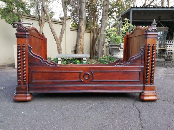 A Carved Mahogany Lit-Bateau