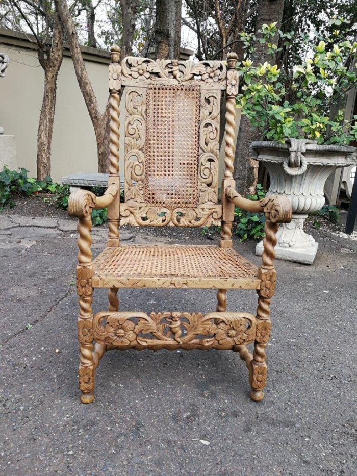 English barley twist carver with rattan seat and back and cherubs