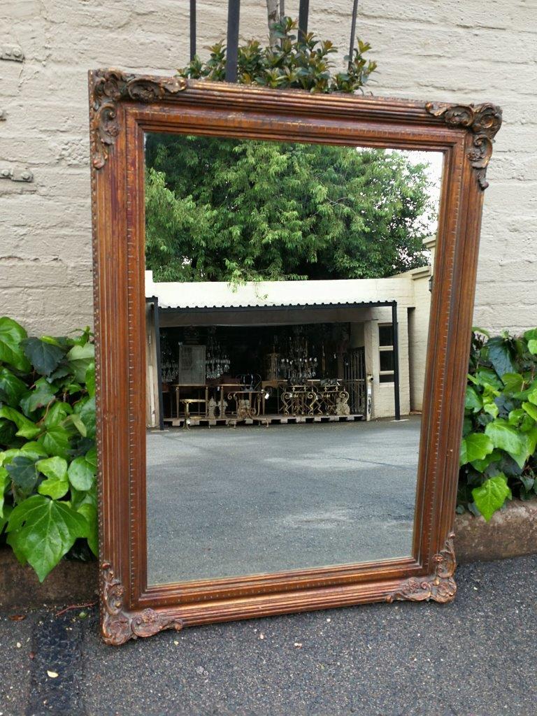 A vintage wooden gilded mirror - The Crown Collection