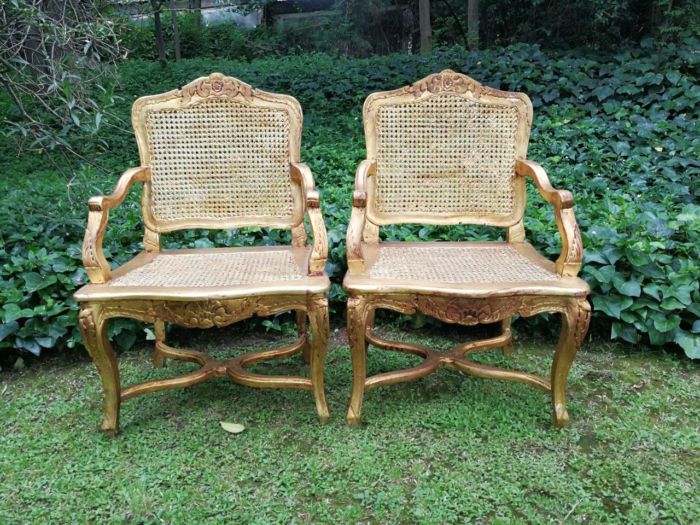 A Pair of 20th Century Hand-Gilded with 22Karat Gold leaf Rattan Armchairs