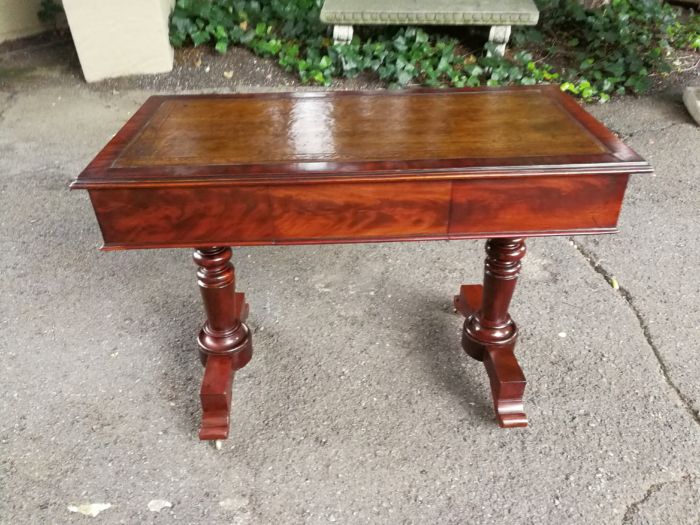 A 19th Century Flamed Mahogany Sofa / Writing Table with Leather and Hand Tooled Top On Cators