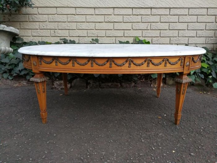 A French-style Marble Top Coffee Table with Brass Decorations