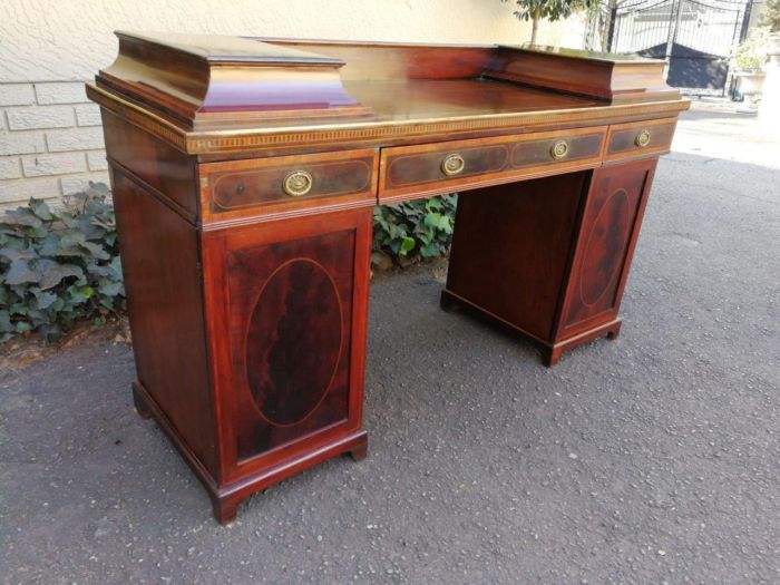 A Late Regency Inlaid Mahogany and Rosewood Pedestal Sideboard, fitted with original oval foliate brass escutcheons and loop handles and with a cellarette drawer - Image 4