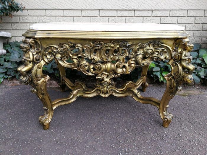 A Walnut Wood Carved Table Hand Gilded with 22Karat Gold Leaf